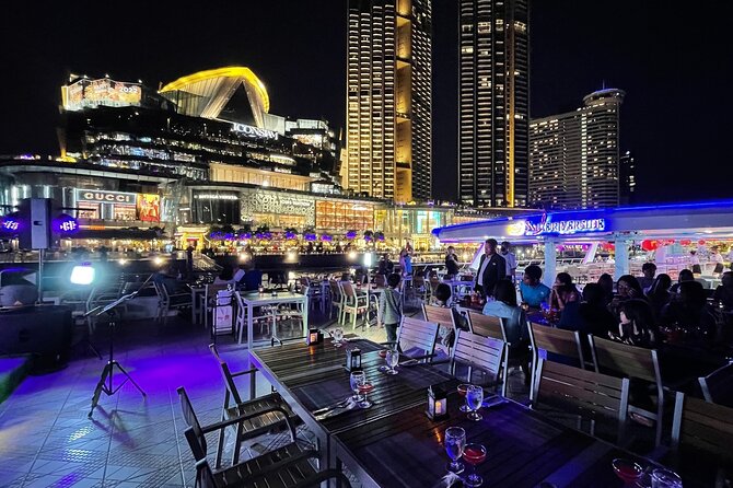Bangkok Dinner Cruise with Intl Buffet, Live Music & Hotel Pickup - The first river views: Taksin Bridge and Asiatique