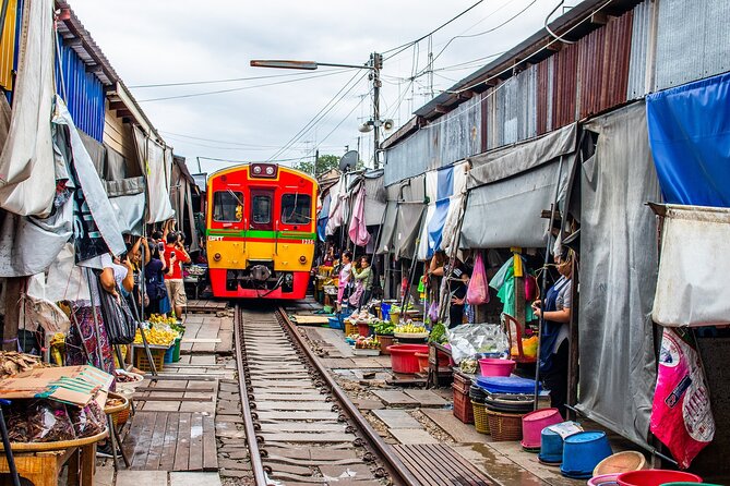Damnoen Saduak Floating Market and Maeklong Railway Market Tour - Wat Bang Kung, a chapel inside a banyan tree