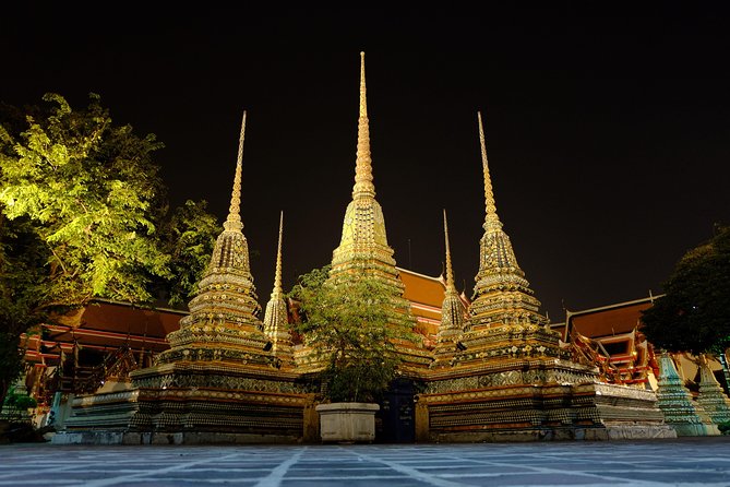 Discover Bangkok at Night 5-Hour Bike Tour with dinner - Wat Arun after dark and views across the water