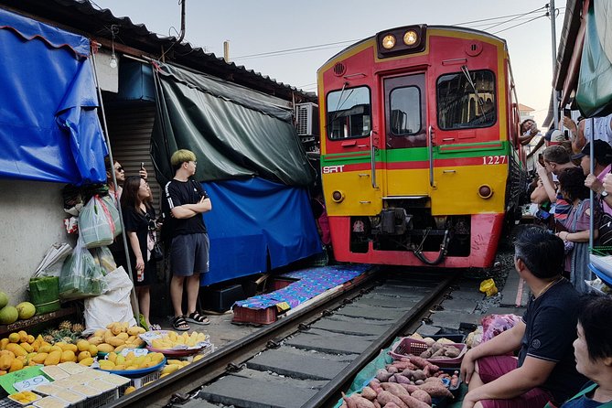 Floating Market Damnoen Saduak and Meklong Railway Market: Half Day Tour - Food, fruit, and the small extras
