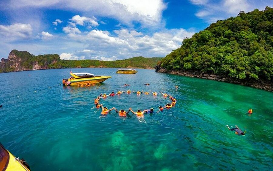 From Ao Nang: Phi Phi Islands Day Tour by Boat with Lunch - What the boat crew and guide add to the day