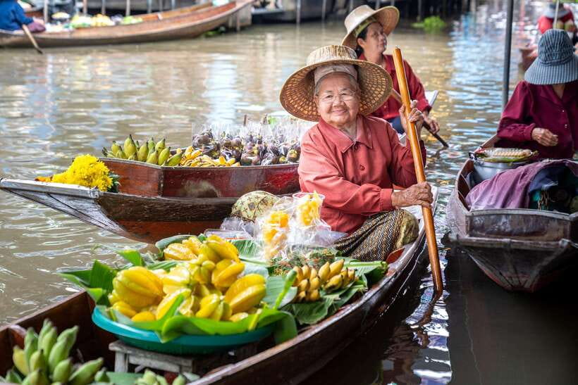 From Bangkok: Railway & Damnoen Saduak Floating Market Tour - Mae Klong Railway Market and the famous umbrella trick