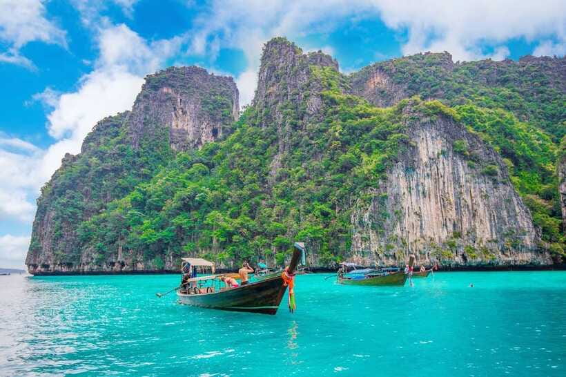 From Phi Phi islands: Phi Phi, Maya Area by longtail Boat - Viking Cave and the meaning of a boat-only view