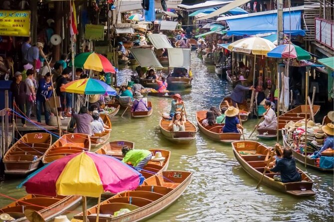 Full-Day Floating Market and Maeklong Railway Market Private Tour from Bangkok - Wat Bang Kung inside banyan tree roots