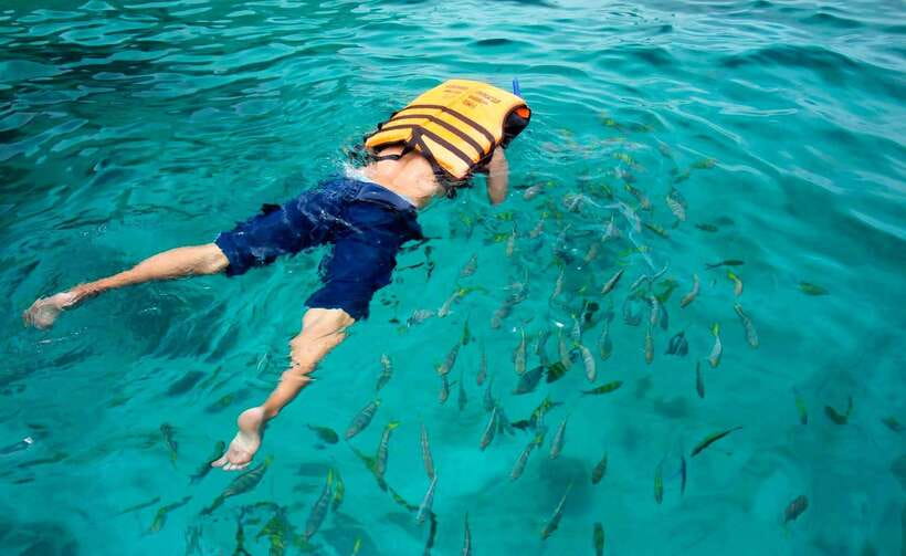 Koh Lipe: 5 Island Snorkeling Trip by Longtail Boat w/ Lunch - Hin Ngam’s polished black stones and photo queue