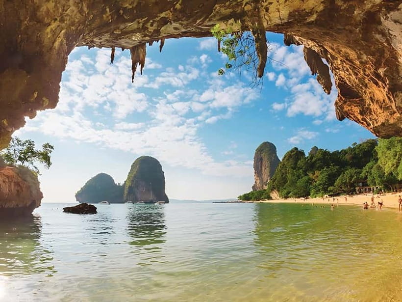 Krabi: Railay Phra Nang & Diamond Cave Sunset Plankton Tour - Phra Nang Beach, cave shrine, and rock climbers