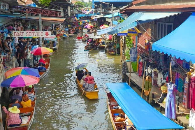 Maeklong Railway and Damnoen Saduak Floating Market Tour - Damnoen Saduak: canals, boats, and shopping