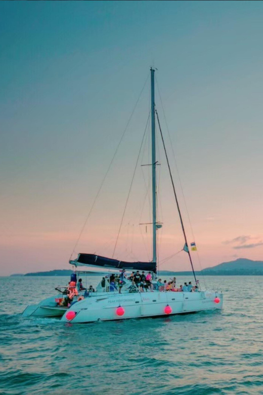 Phuket: Coral Island Catamaran Cruise with Sunset Dinner - Sailing Toward Promthep Cape