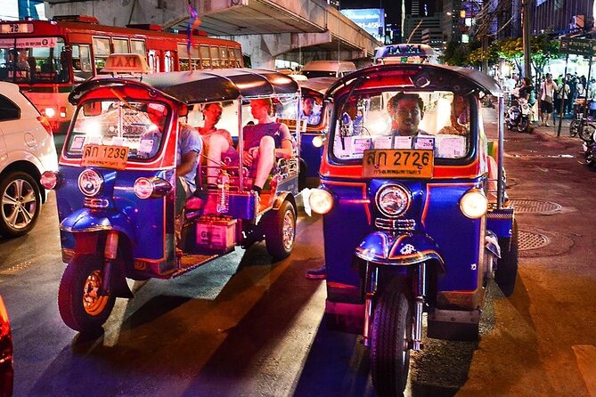 Private Bangkok Night Tour by Tuk Tuk with Dinner - Wat Arun under evening lights