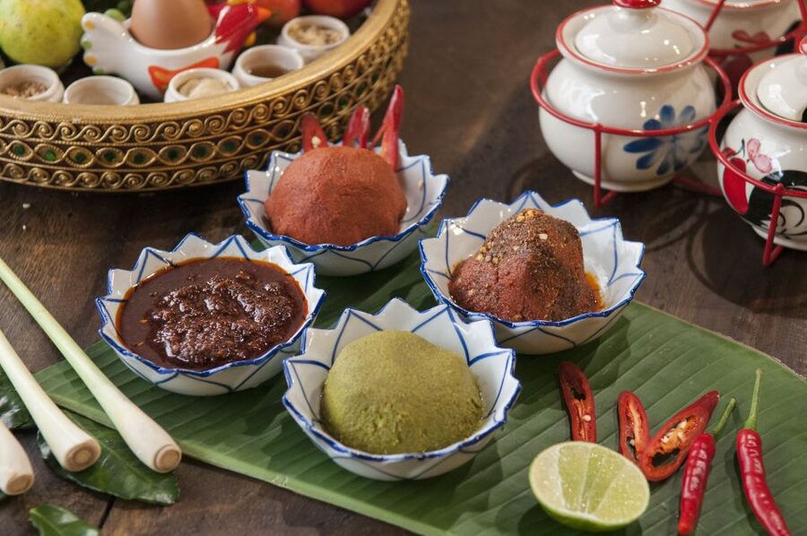 Sukhumvit: Hands-on Thai Cooking Class & Market Tour in BKK - Making curry paste with your own hands